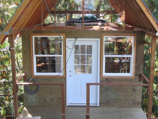 Floating Treehouse from the east side, with covered porch and view of loft.