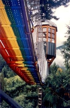 Easter Sunday 2004 -- "The Rainbow Bridge"
												   is successfully hoisted into place, connecting the " Stairway to Heaven " 
												   to the Treehouse Observatory (in background), 100 feet above the forest floor